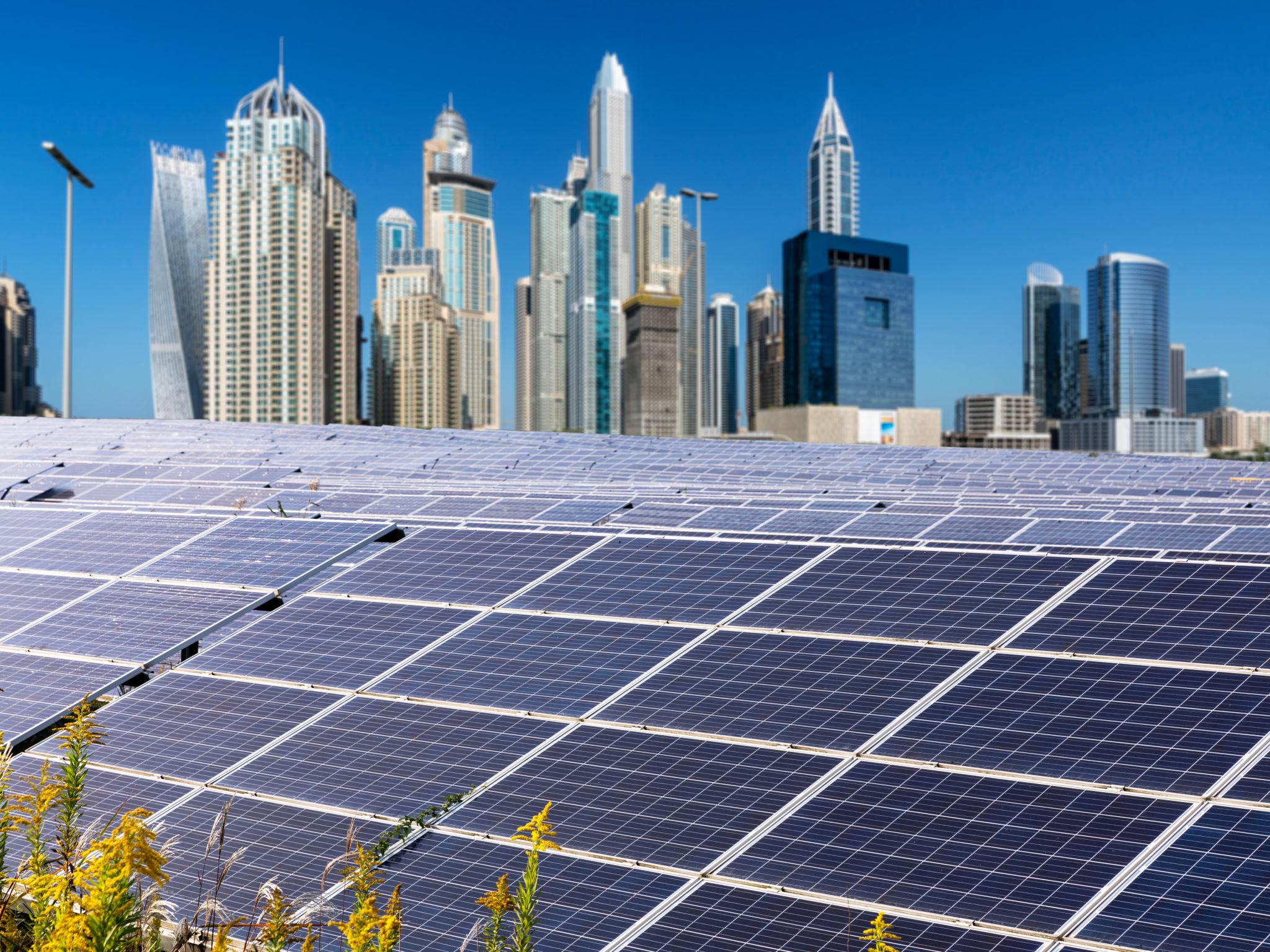 Commercial solar panels Dubai installation by UltraSmart" or "Solar ROI chart UAE